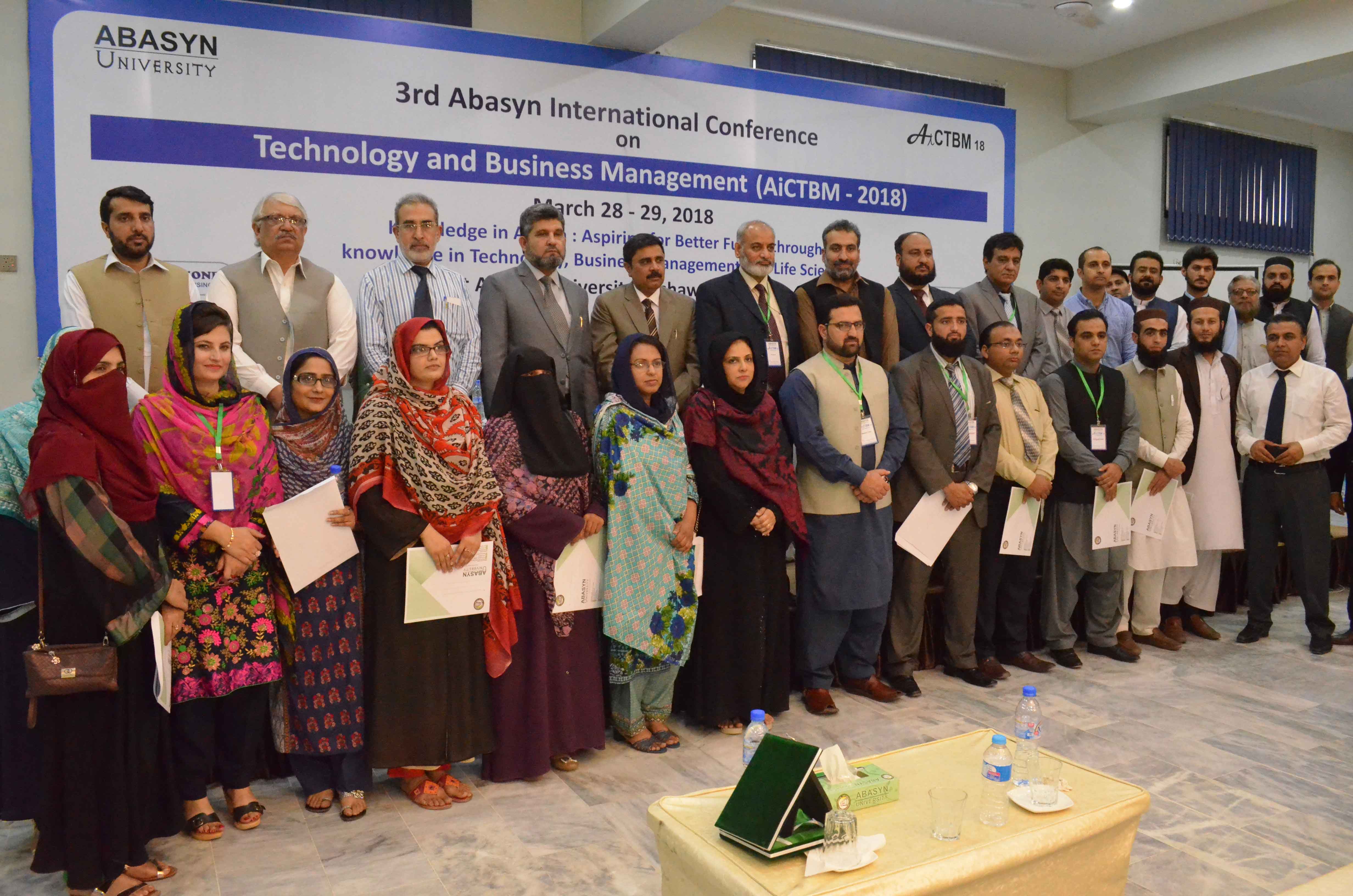 Group photo of HODs of different departments, faculty members and organisers with Chancellor and Vice Chancellor Abasyn university at the AICTBM Conference 