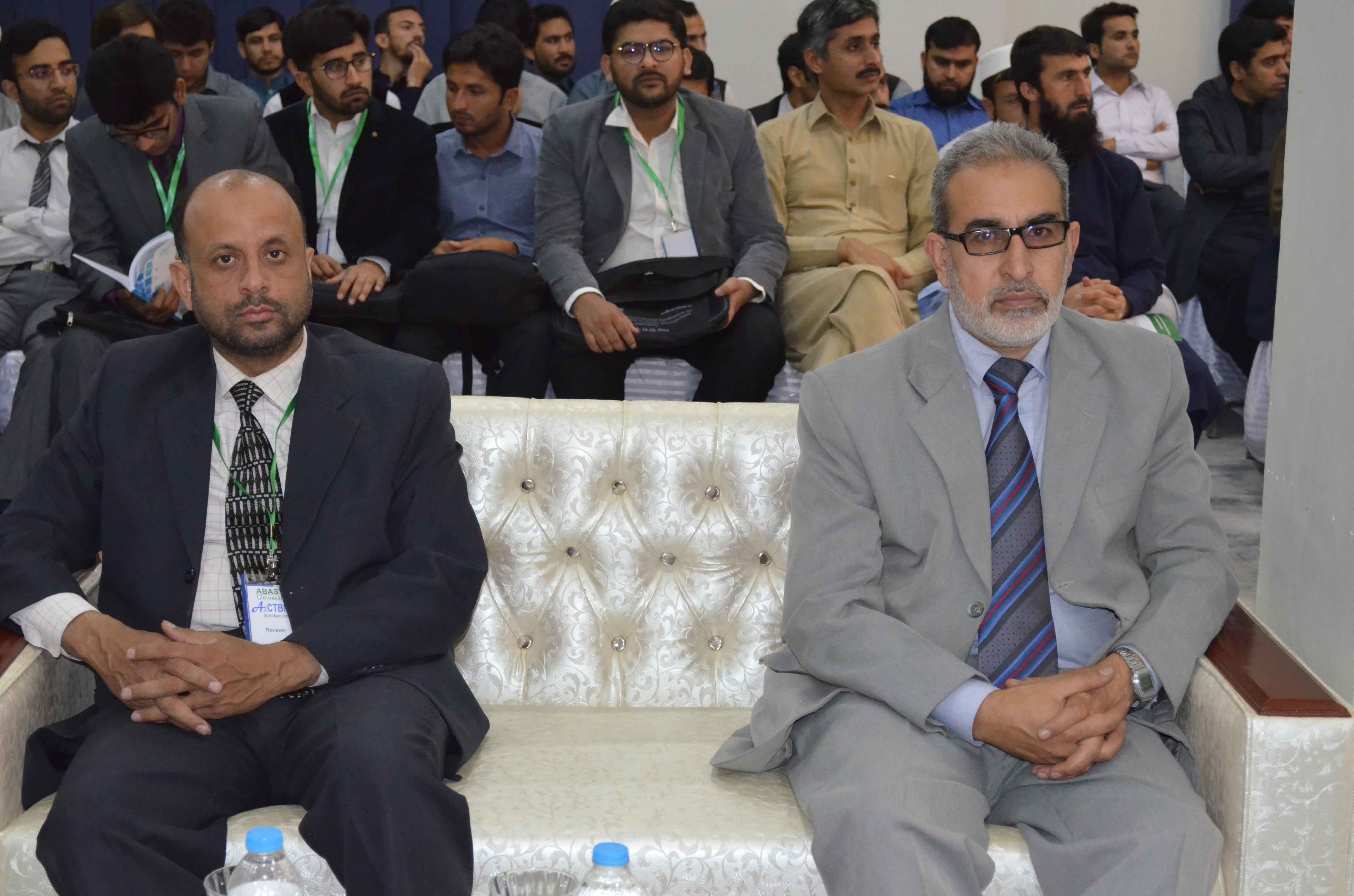 Honorable guests are listening the speech by different scholars at the conference